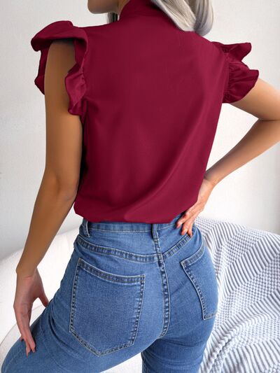 Blusa con mangas japonesas y cuello anudado