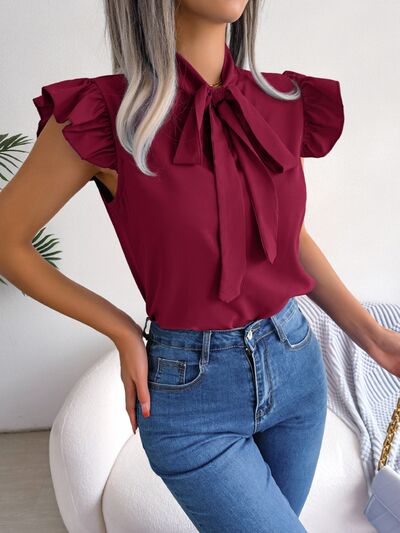 Blusa con mangas japonesas y cuello anudado