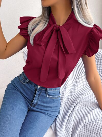 Blusa con mangas japonesas y cuello anudado