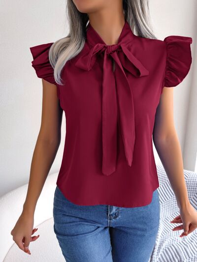 Blusa con mangas japonesas y cuello anudado