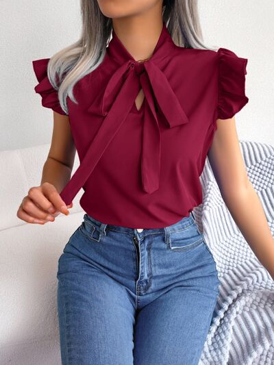 Blouse à manches courtes et col noué